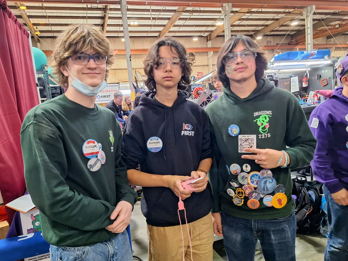 Team Epsilon members working on a robot