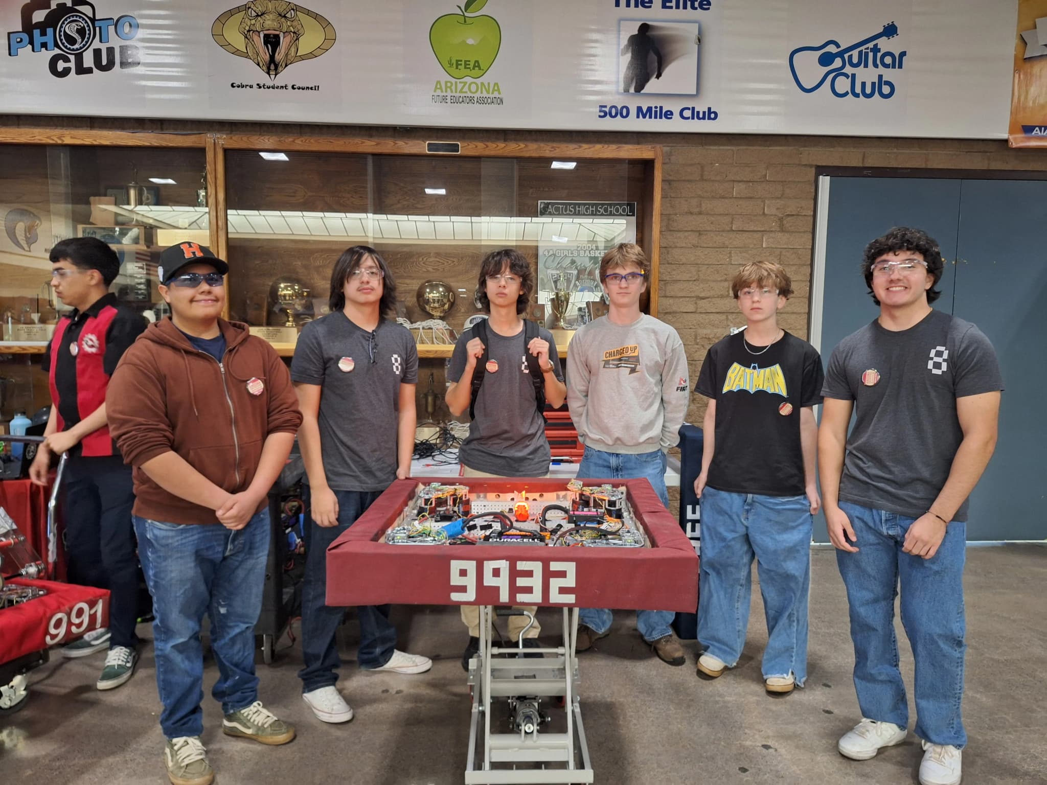 Team Epsilon members working on a robot